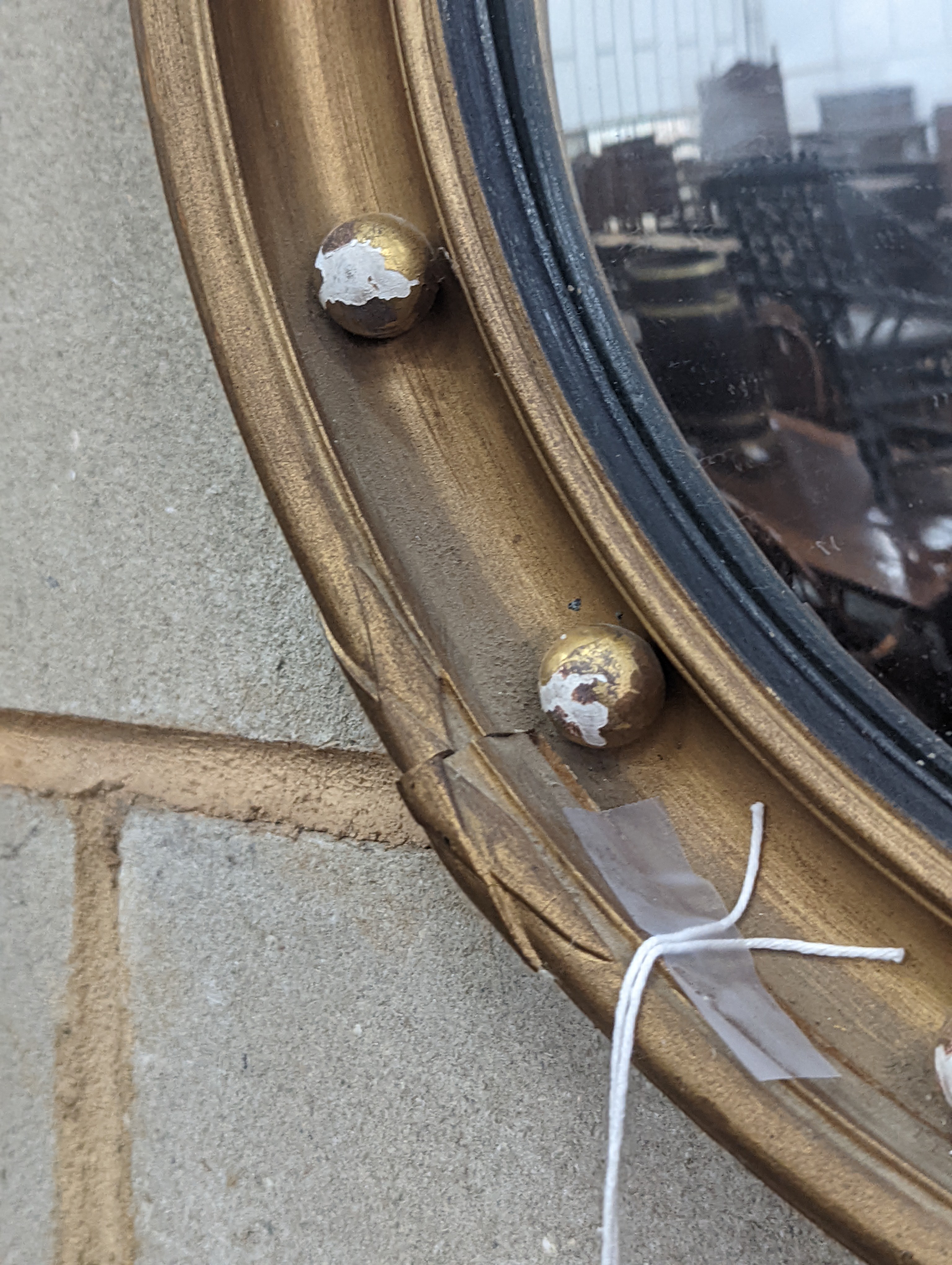 A Regency style circular gilt framed convex wall mirror, diameter 45cm